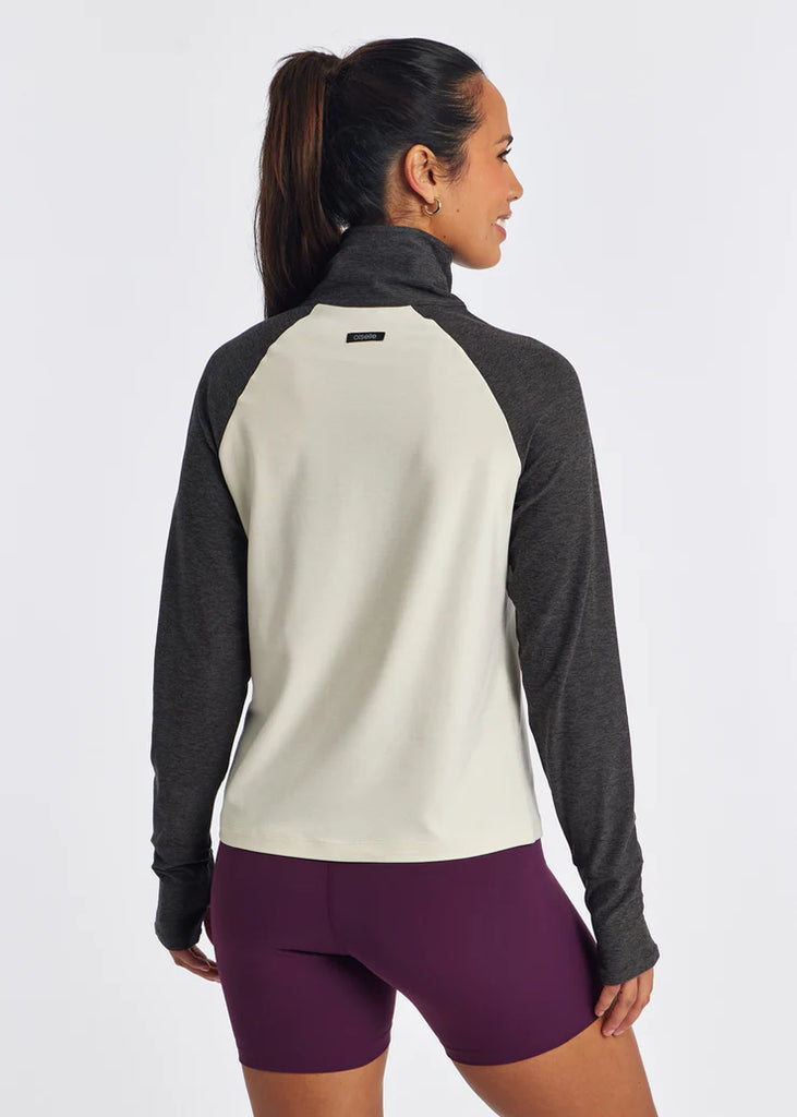 Women's On Running Lux Half Zip. Ivory torso. Dark sleeves. Rear view.