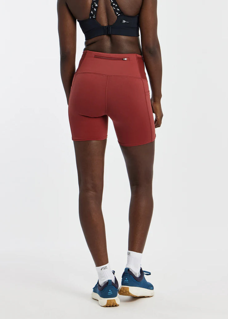 Women's Oiselle Pocket Jogger Shorts. Red/Brown. Rear view.