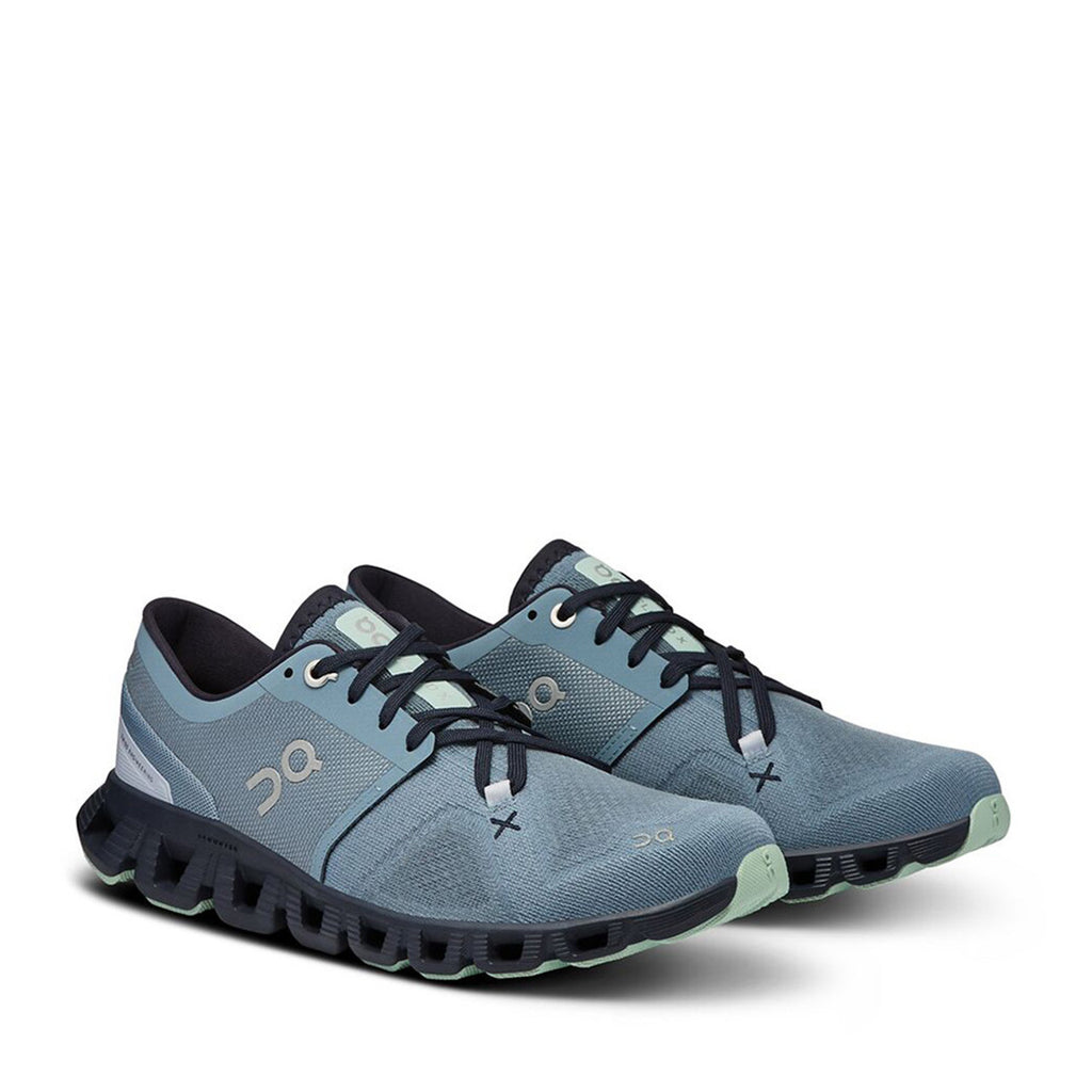 Women's On Cloud X 3. Blue upper. Black midsole. Lateral view.