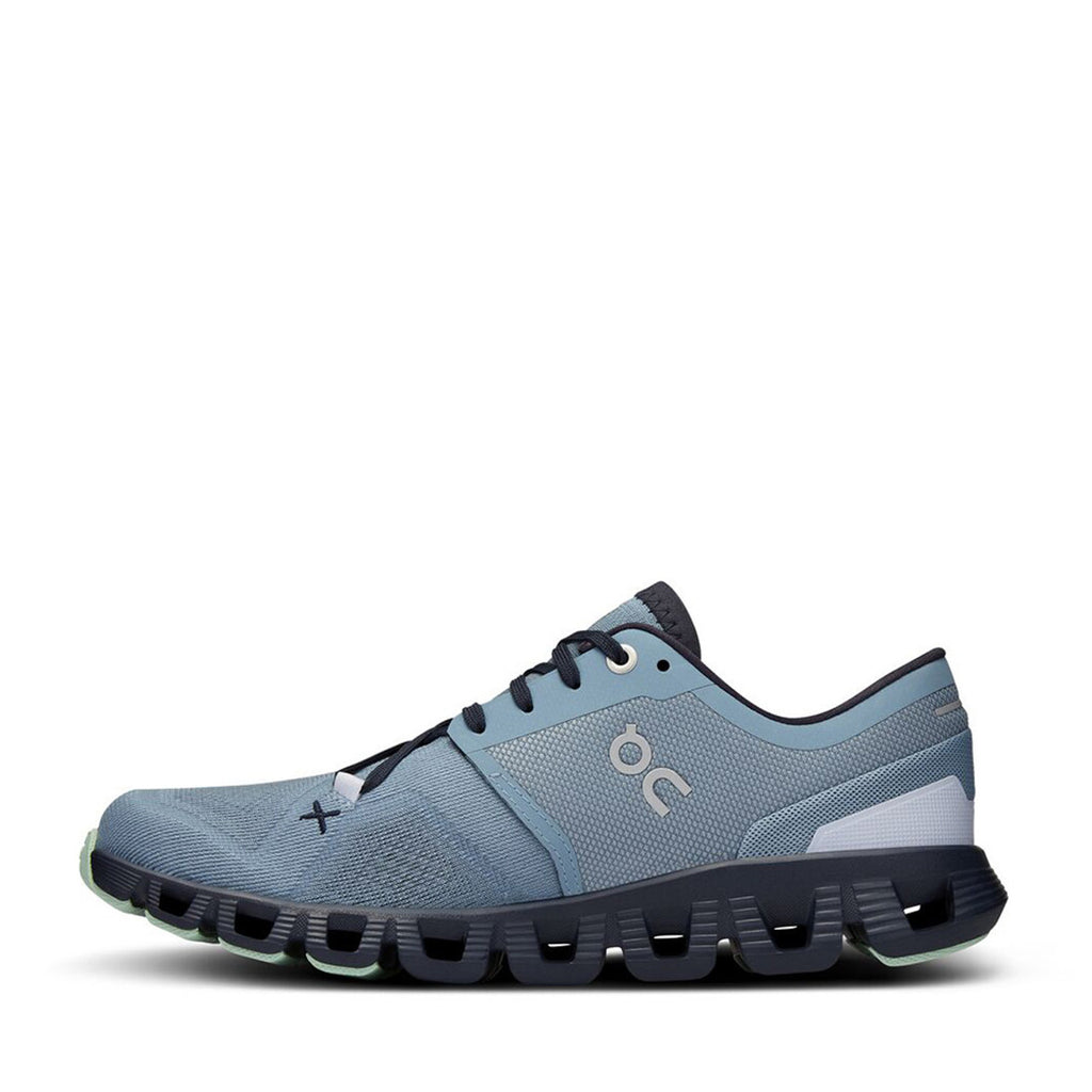 Women's On Cloud X 3. Blue upper. Black midsole. Medial view.