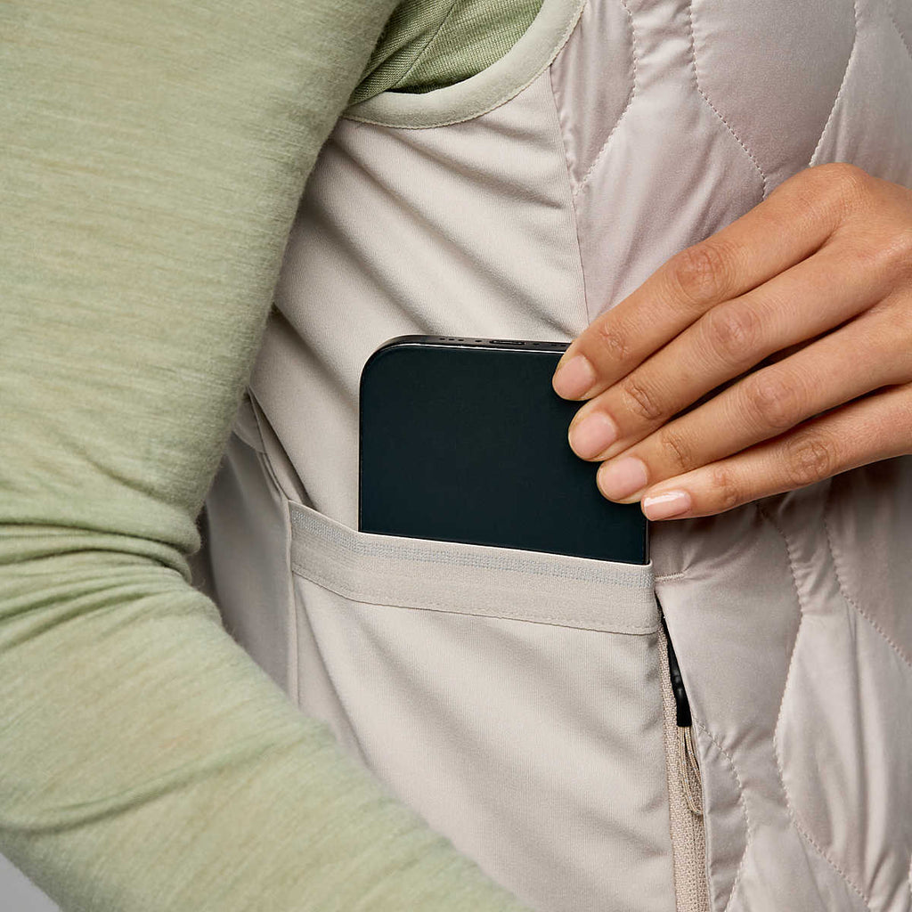 Women's Saucony Hurricane Insulated Vest. White. Pocket closeup.