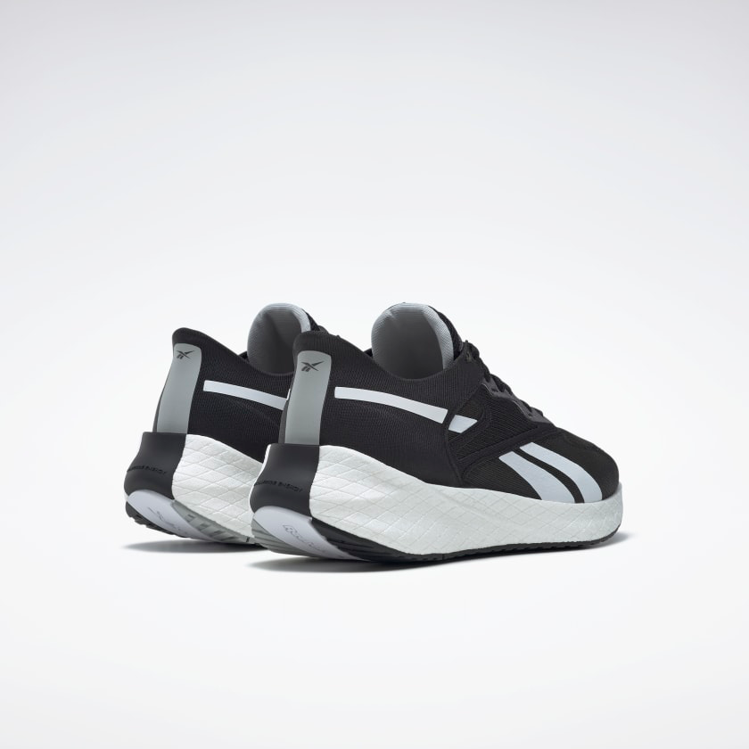 Men's Reebok Floatride Energy Symmetros 2. Black upper. White midsole. Rear/Lateral view.