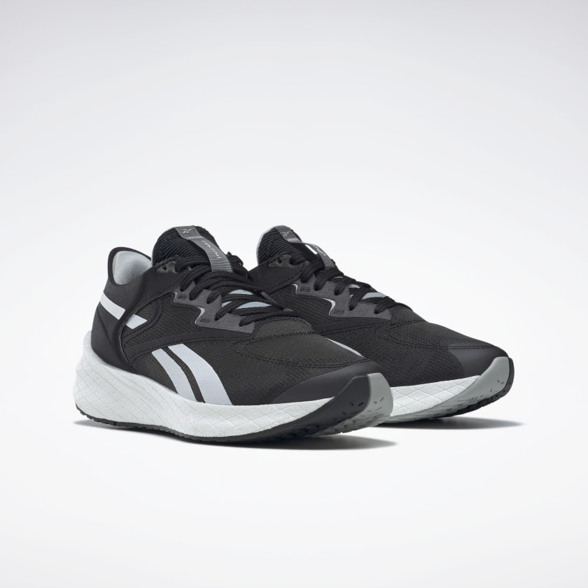 Women's Reebok Floatride Energy Symmetros 2. Black upper. White midsole. Lateral view.