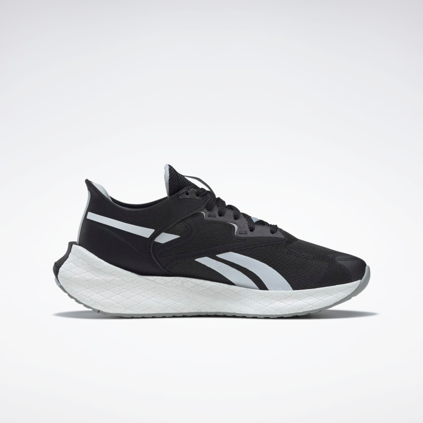 Men's Reebok Floatride Energy Symmetros 2. Black upper. White midsole. Medial view.