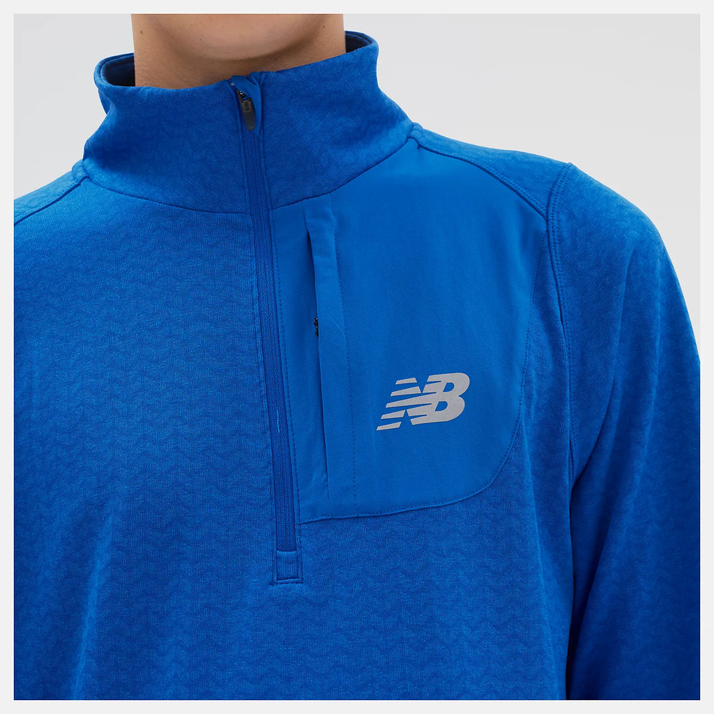 Men's New Balance Heat Grid Half-Zip. Blue. Front closeup.